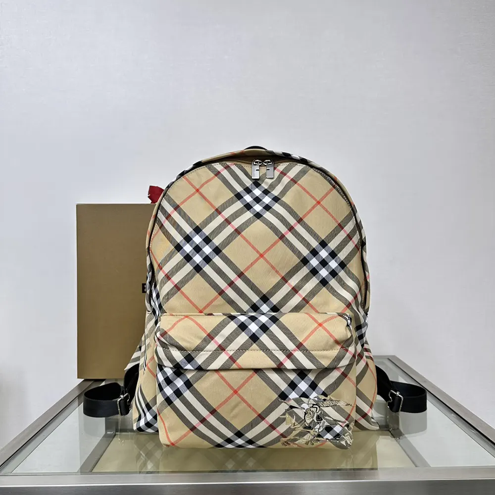 Close-up of Burberry Women Check Backpack leather trim and gold hardware