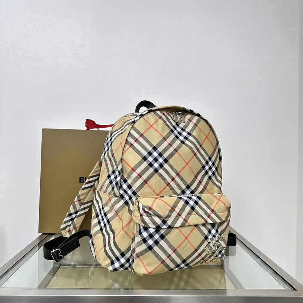 Side angle highlighting adjustable straps on Burberry Women Check Backpack
