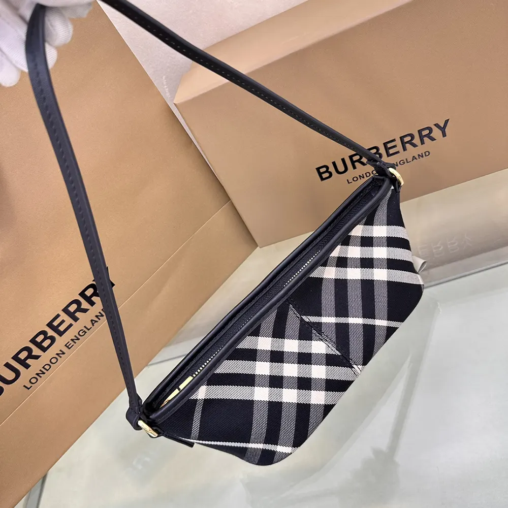 Side angle of Burberry Women Check Mini Bag-Black with adjustable strap