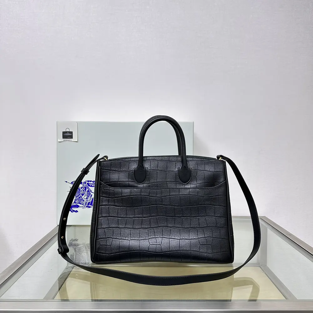 Side profile of structured silhouette on Burberry Women Medium Rocking Horse Tote