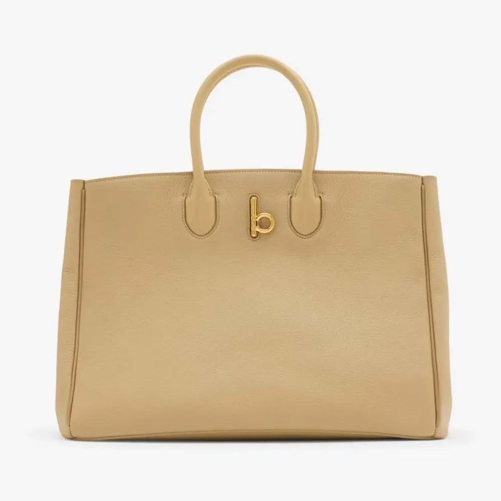 Front view of Burberry Women Medium Rocking Horse Tote​-Sandy with emblem