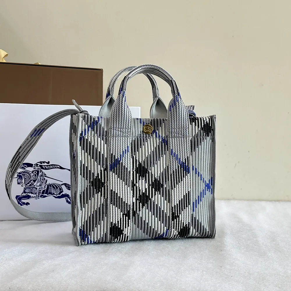 Side angle showing silhouette and zip closure on Burberry knitted tote