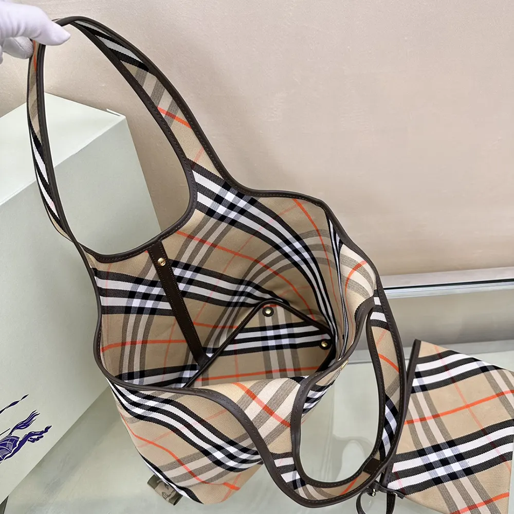 Side angle highlighting compact silhouette of Burberry Women Small Check Tote