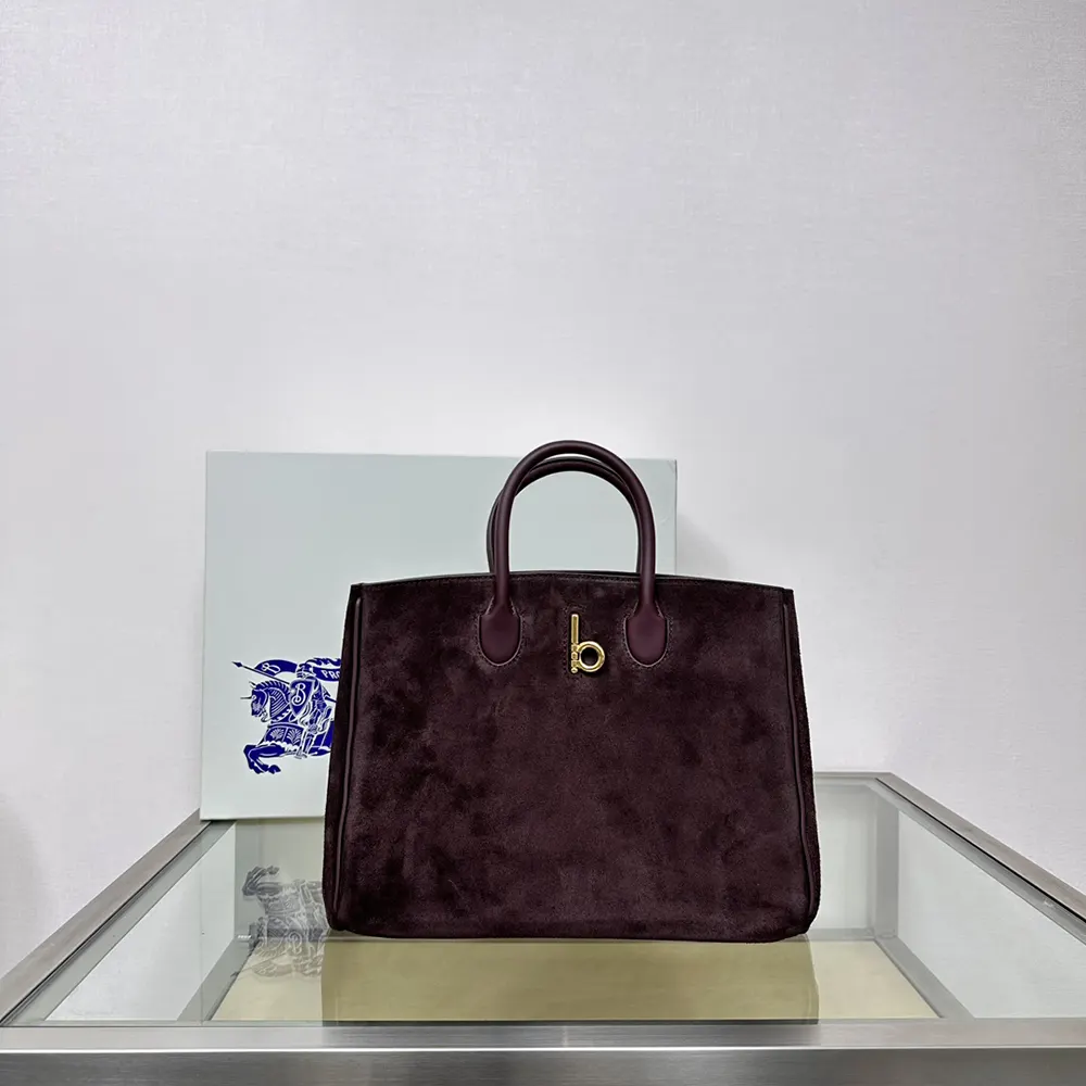 Close-up of embossed Rocking Horse motif on Burberry Small Rocking Horse Tote