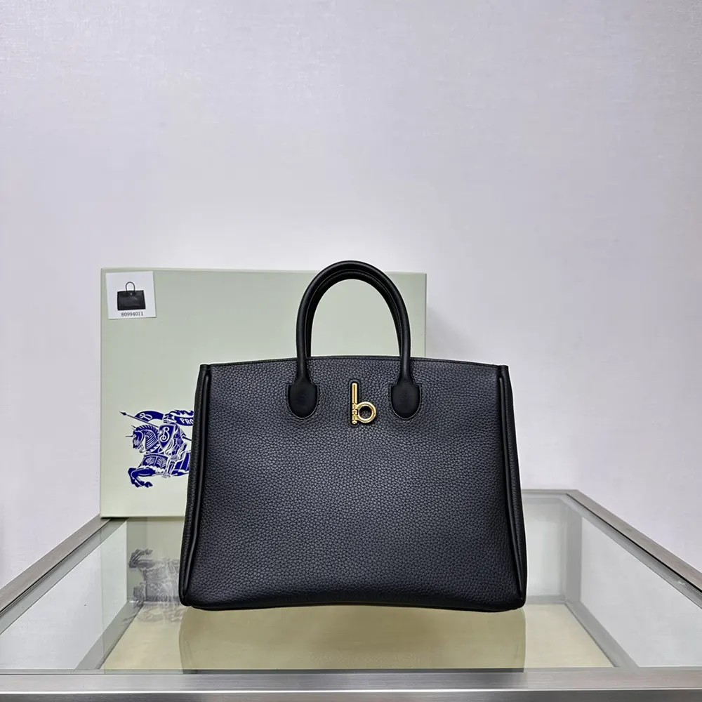 Close-up of signature Rocking Horse emblem on Burberry Small Rocking Horse Tote