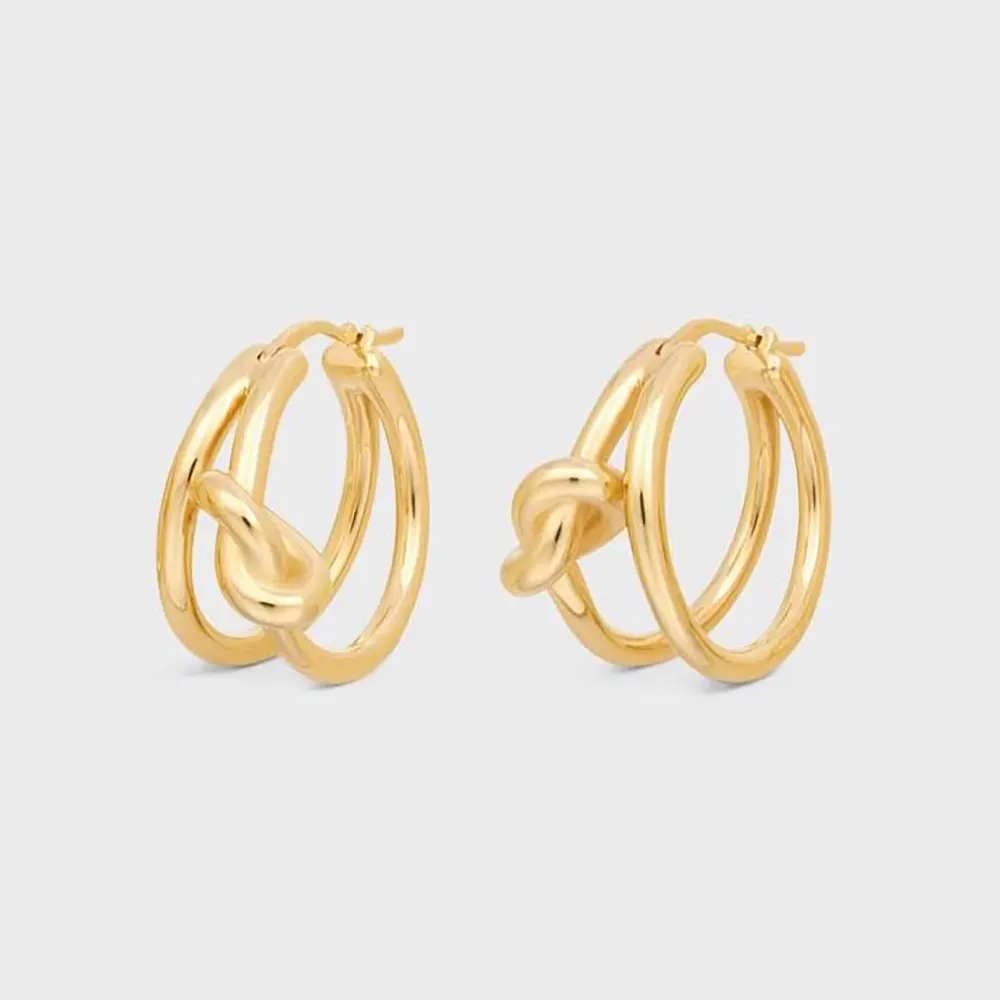 Front view of Celine Women Knot Double Hoops in Brass with Gold Finish