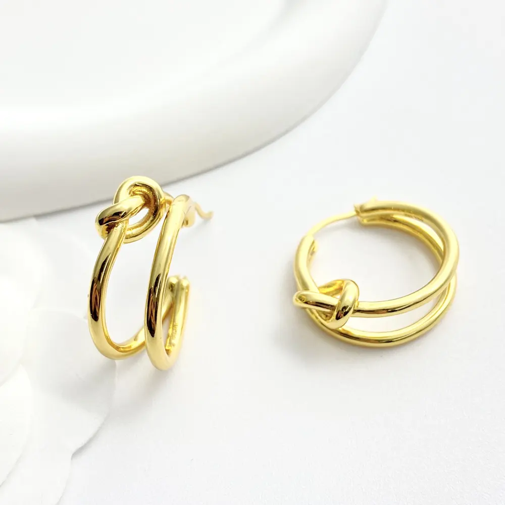 Close-up of knotted detail on Celine Women Knot Double Hoops