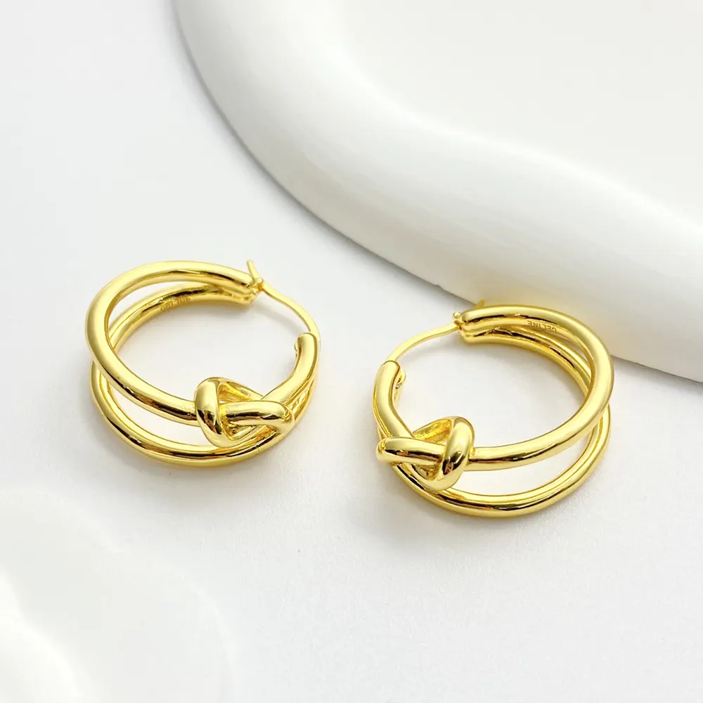 Side angle showing latch closure on Celine Women Knot Double Hoops