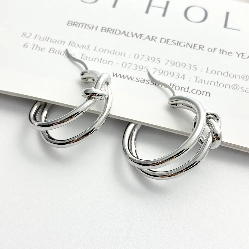 Close-up of knotted design detail on Celine Women Knot Double Hoops