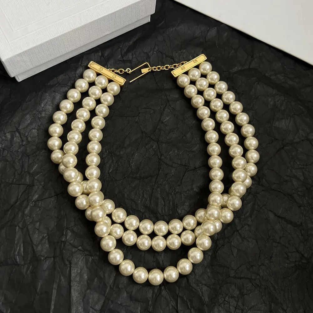 Full length of Celine Women Les Perles Celine Necklace styled on mannequin