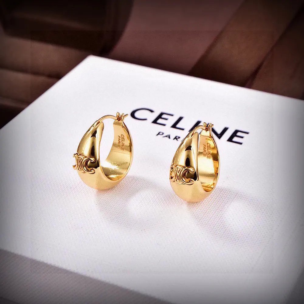 Close-up of engraved Triomphe logo on Celine Women Triomphe Bold Hoops