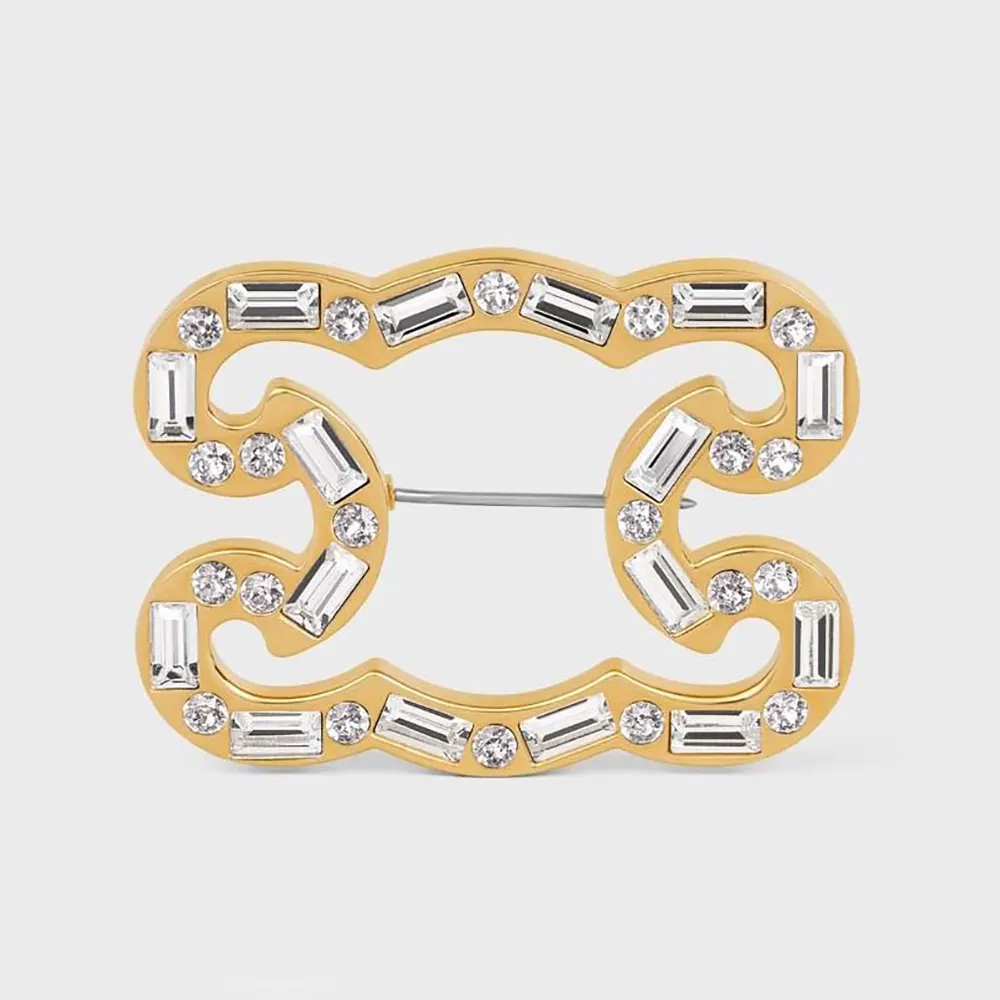 Close-up of Celine Women Triomphe Frame Sparkle Brooch displaying gold strass detail