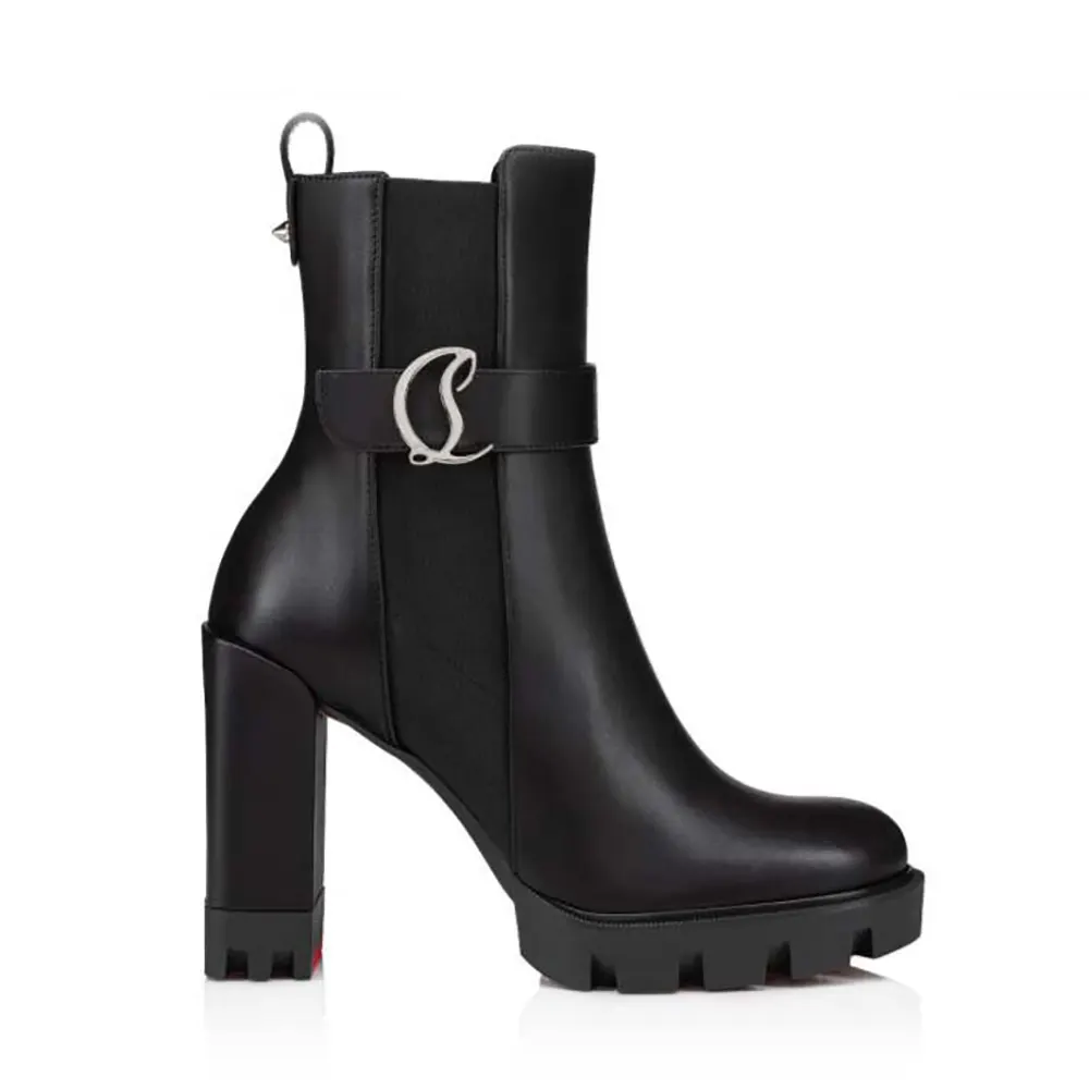 Side view of Christian Louboutin Women CL Chelsea Lug 100 mm Low Boots Black