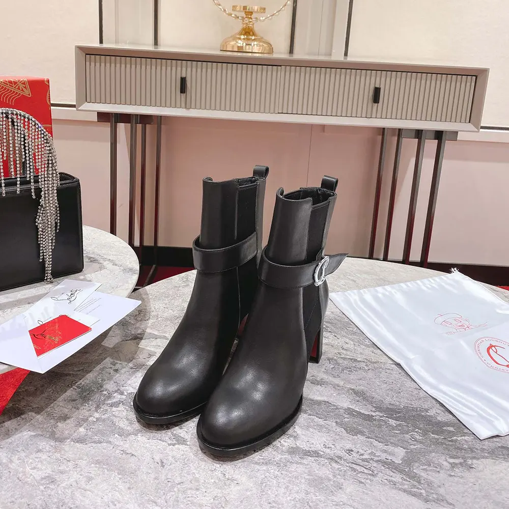 Back angle showing elastic panels on Christian Louboutin Chelsea Lug boots