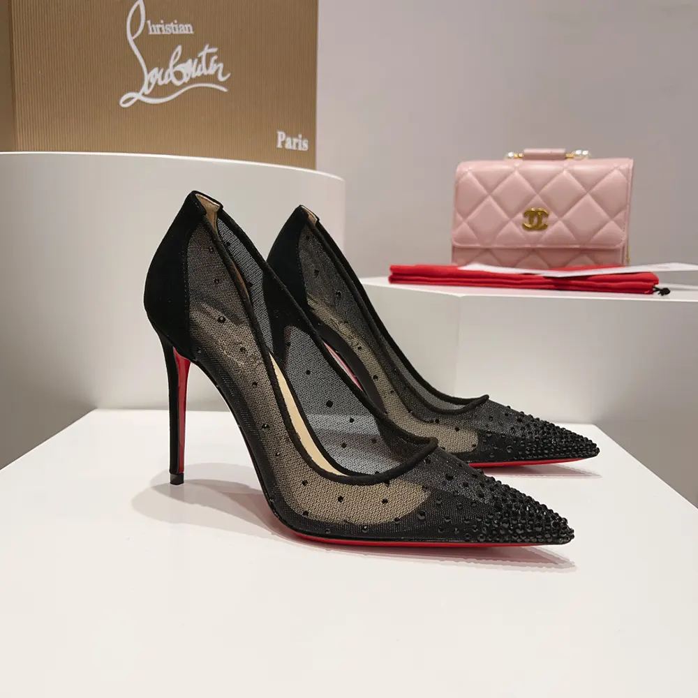 Overhead shot showing black suede material on Christian Louboutin Women Follies Strass pumps