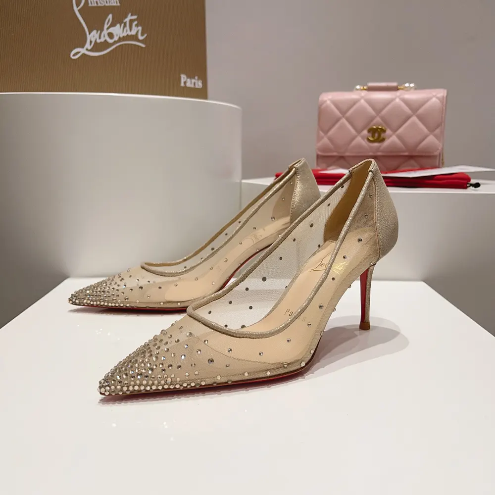 Overhead view showcasing mesh and suede materials on Christian Louboutin pumps