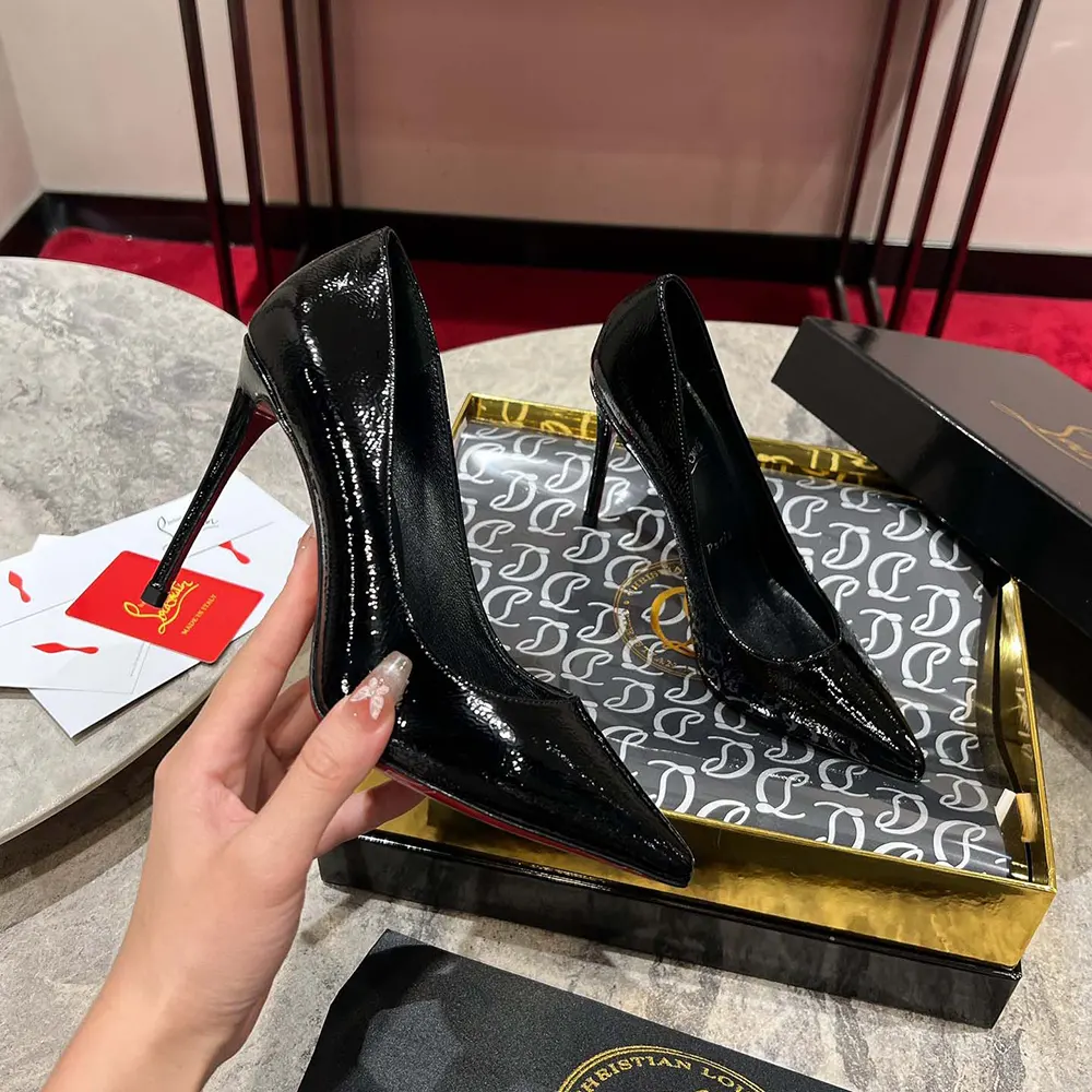 View of signature red sole of Christian Louboutin Women Kate 100 mm Pumps in black
