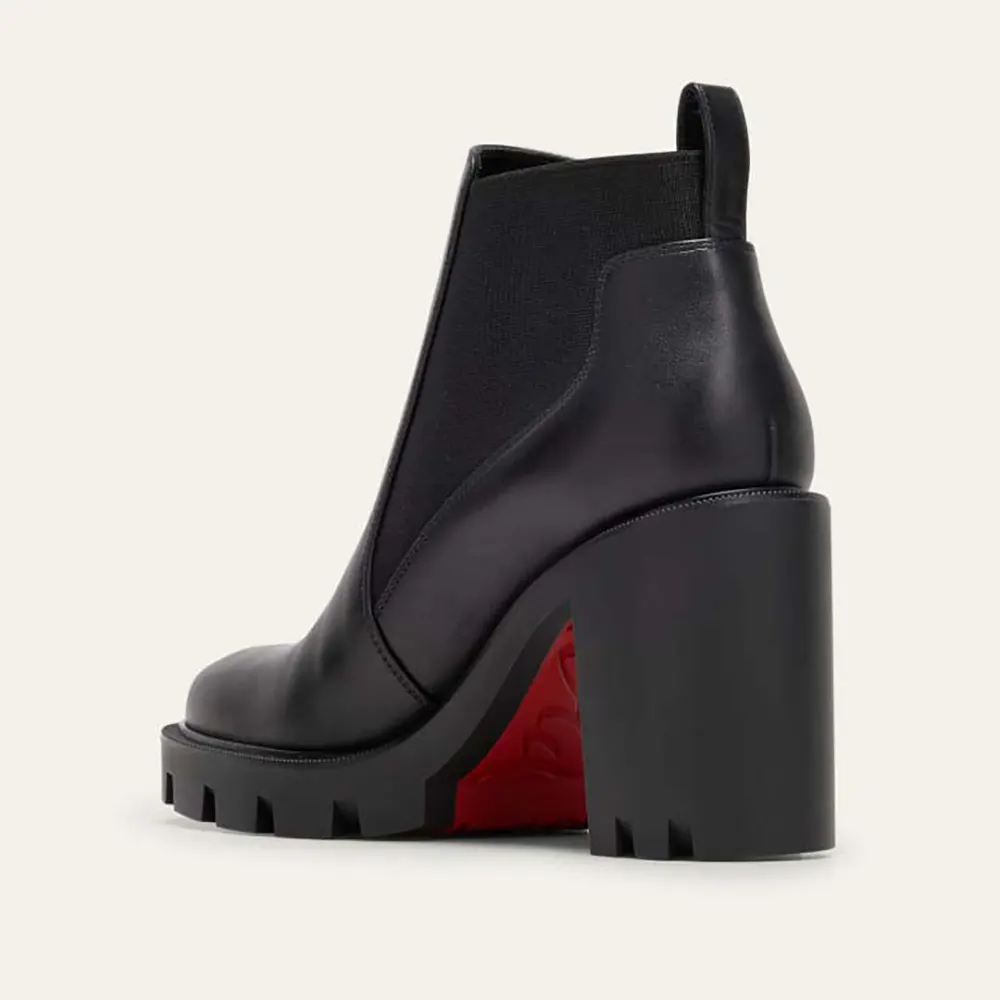 Rear angle showcasing heel and leather texture on Christian Louboutin booties