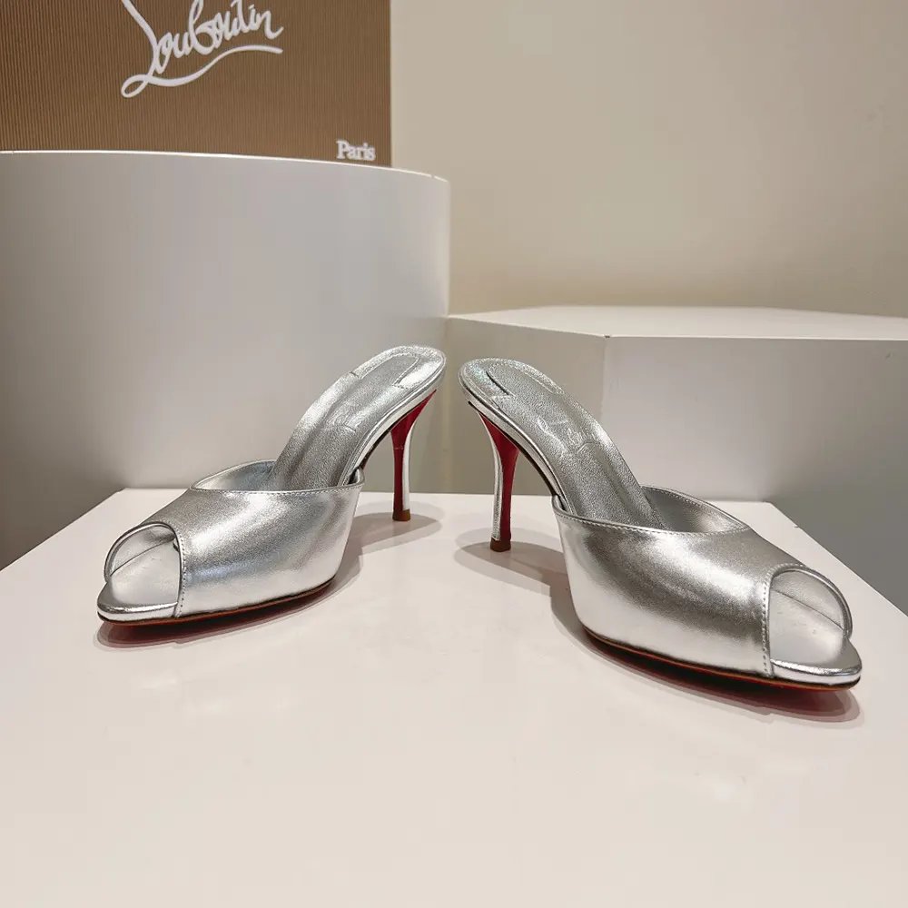 Rear angle showing 100 mm heel and spike on Christian Louboutin mules