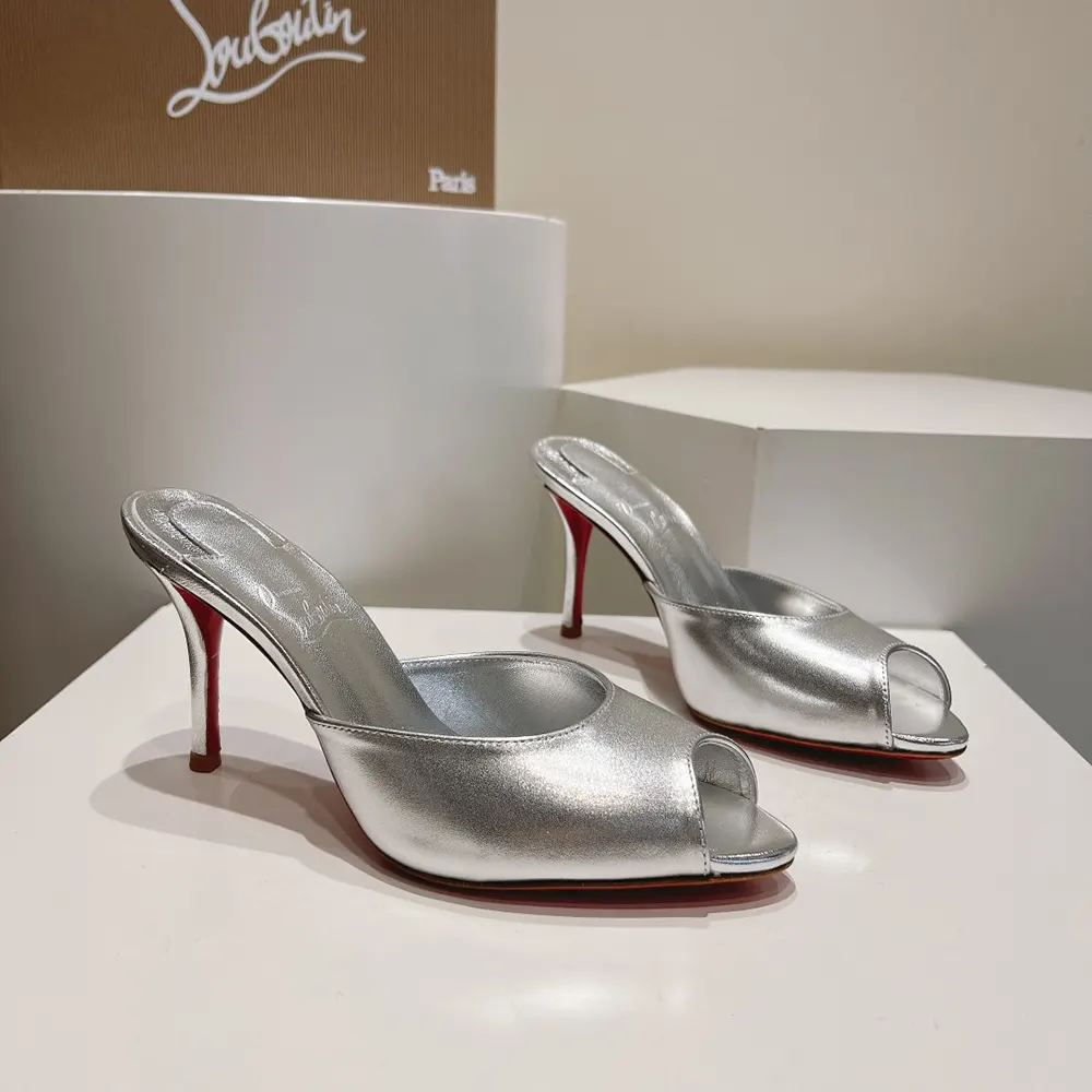 Close-up on silver nappa leather and signature red sole detail