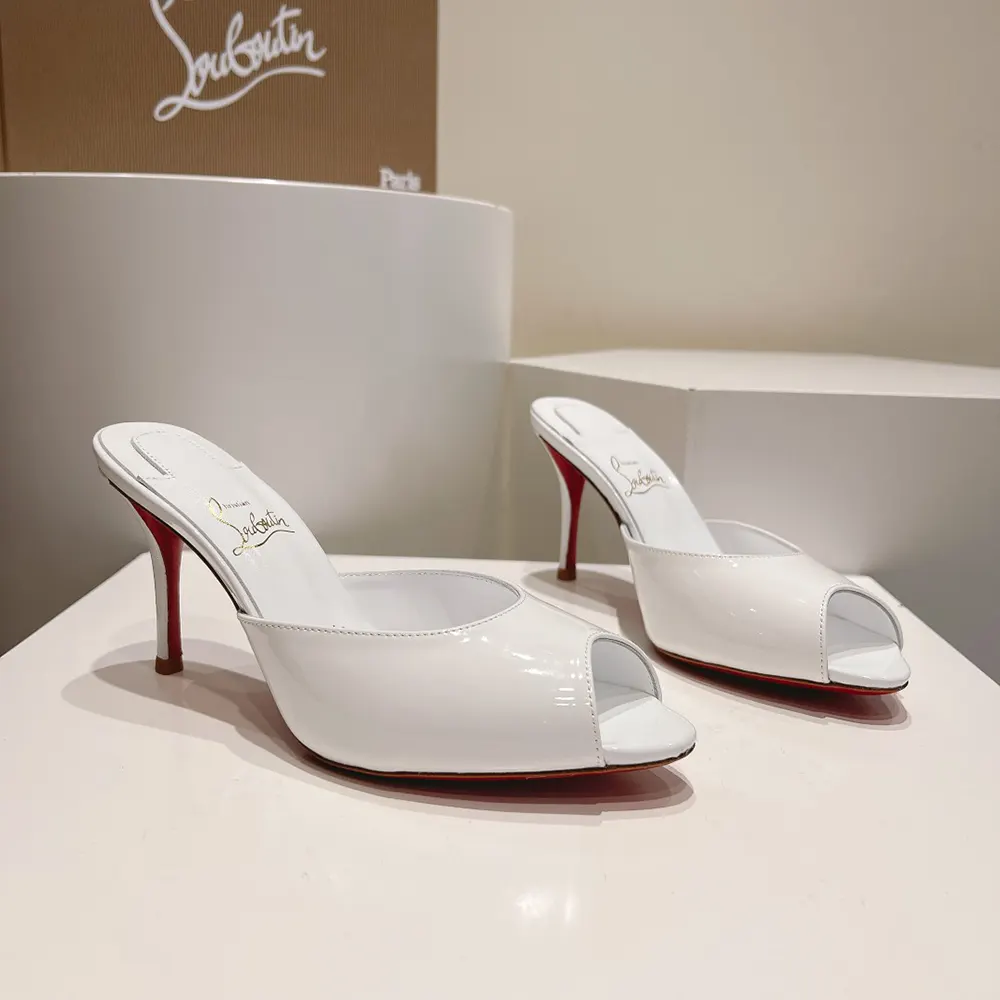 Top angle showing sleek white mule silhouette and heel height