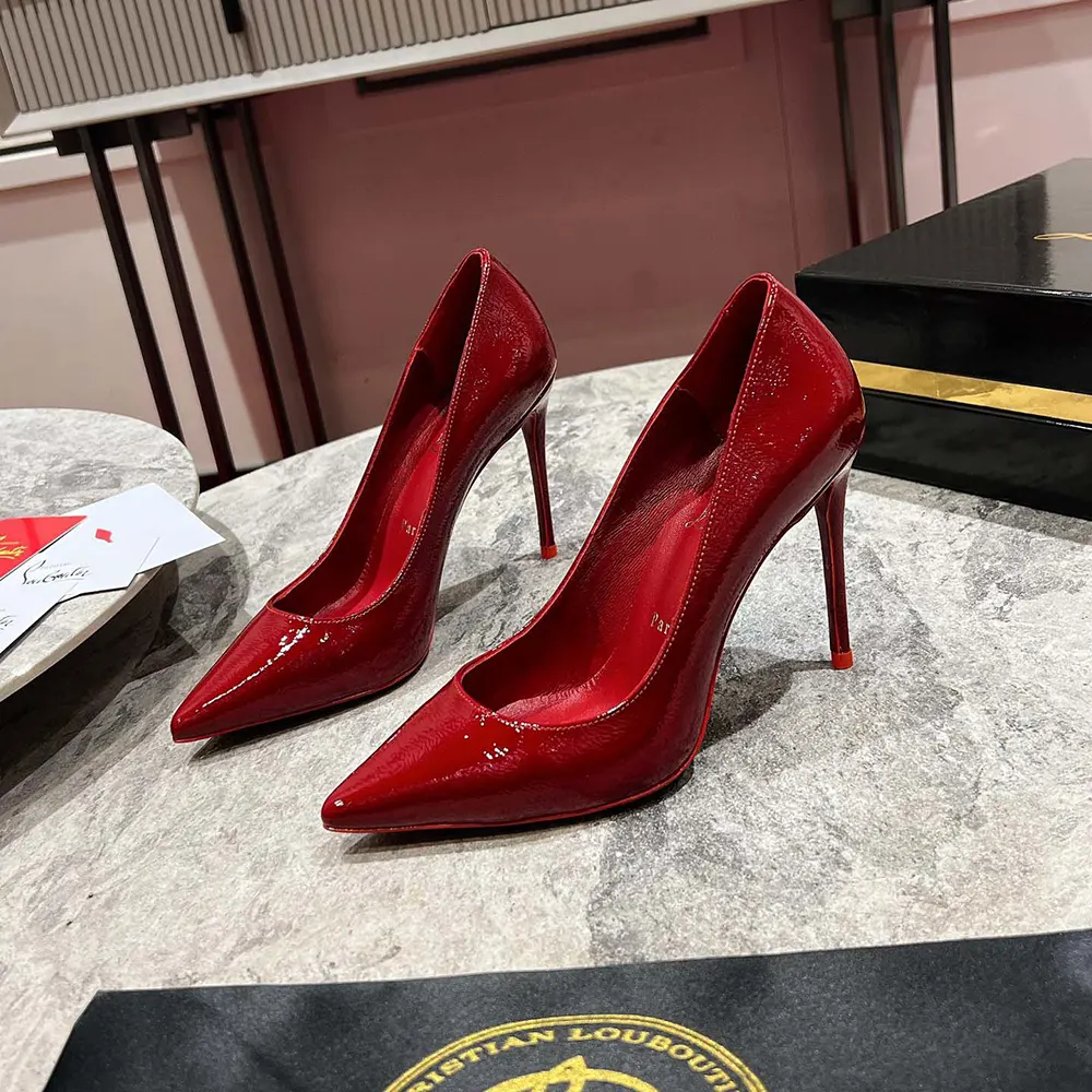 Close-up of glossy patent leather and red sole on So Kate pumps