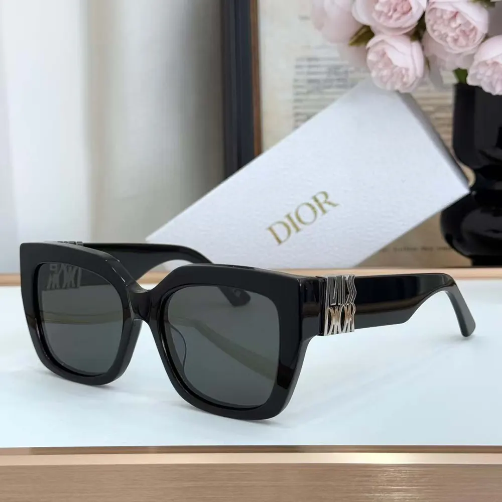 Close-up of silver-tone Dior logo detail on temples of sunglasses