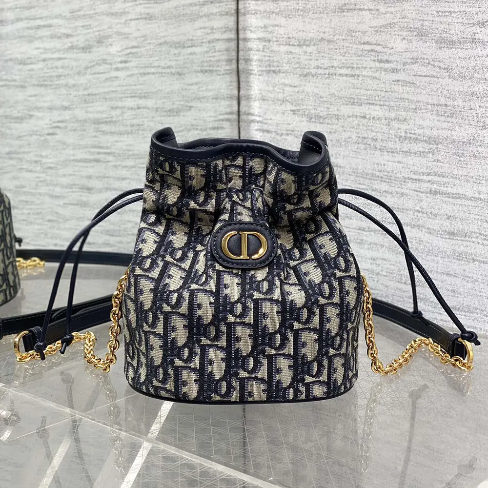Close-up of gold drawstring hardware on Dior Women 30 Montaigne Mini Bucket Bag