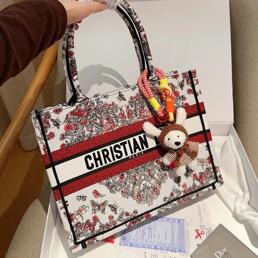 Side view showcasing polished silver hardware on Dior Women Dioramour tote