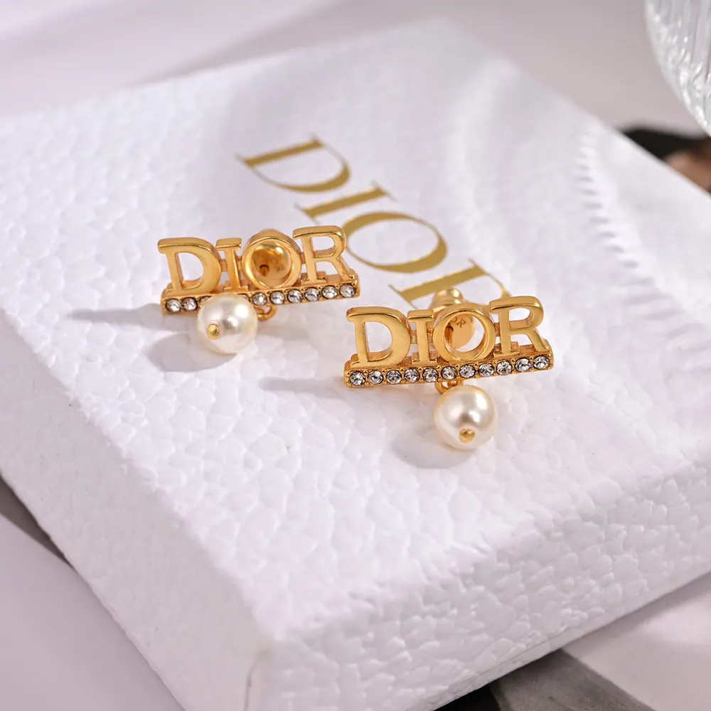 Close-up on white resin pearls and silver-tone crystals detail