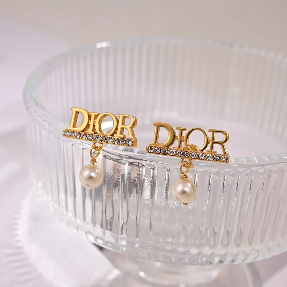 Side angle showing drop silhouette of Dior Women Dio(r)evolution Earrings