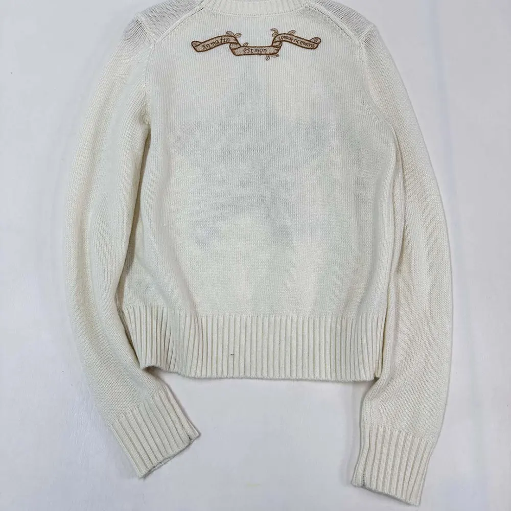 Side profile showing relaxed fit of Dior Women Embroidered Sweater Ecru Cashmere Knit