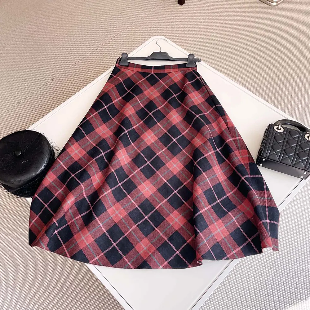 Side angle showing flared silhouette of Dior Women Mid-Length Virgin Wool Skirt