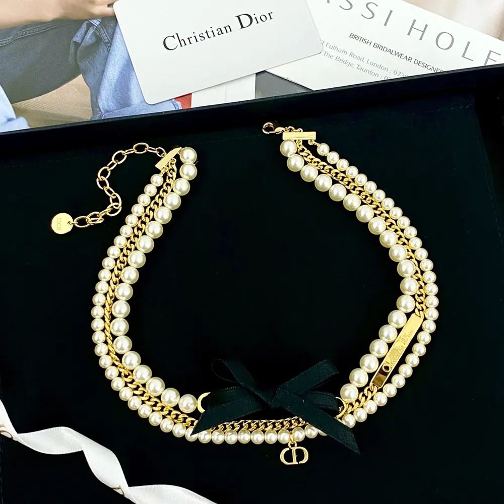Side angle highlighting gold-finish metal detail on Dior Women choker