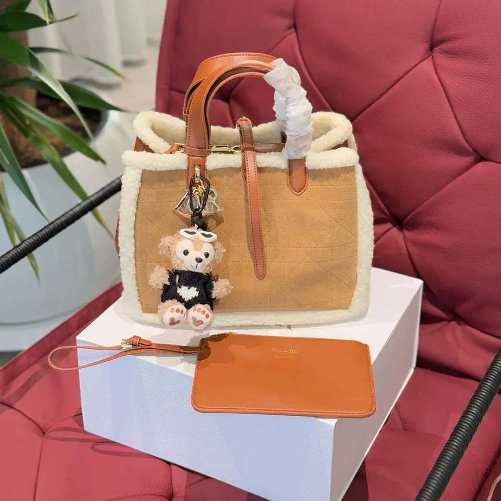 Close-up showing shearling and leather on Dior Women Medium Dior Toujours Bag