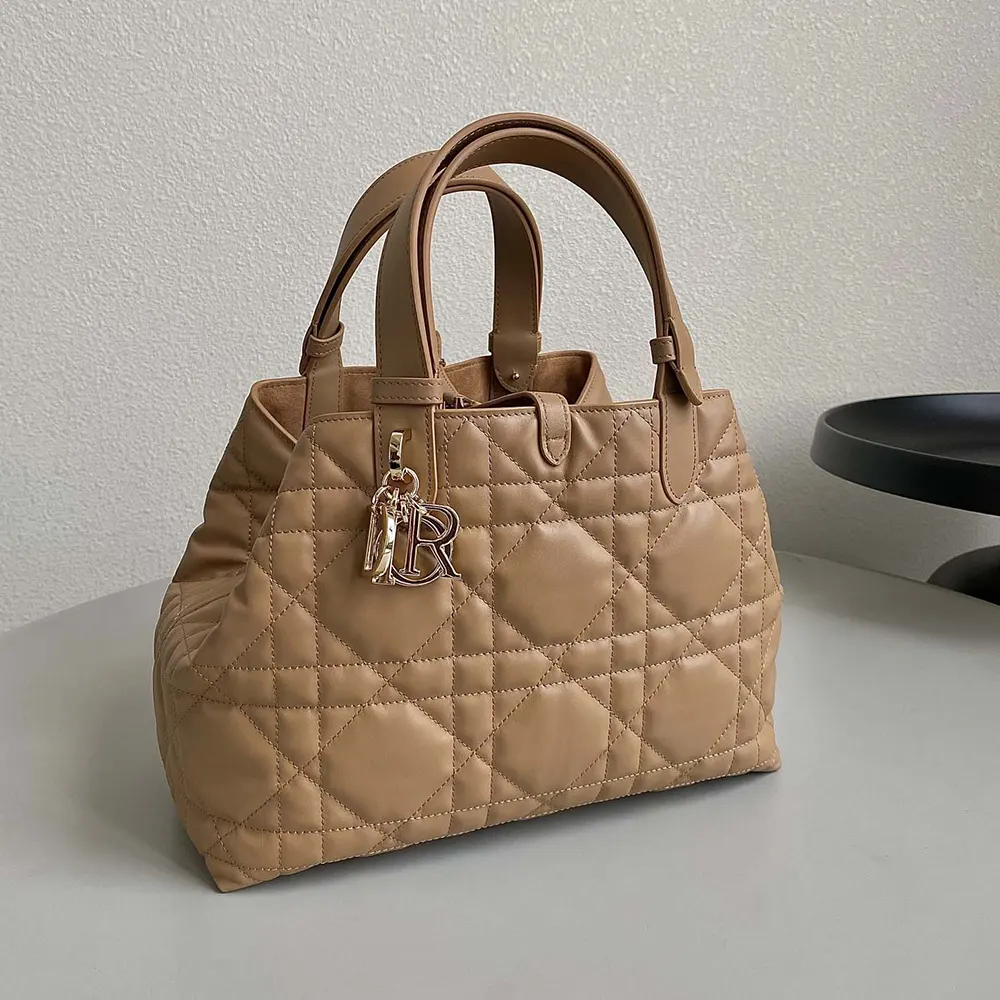 Side profile showing strap and stitching detail on Dior Women Medium Dior Toujours Bag Medium Tan Macrocannage Calfskin