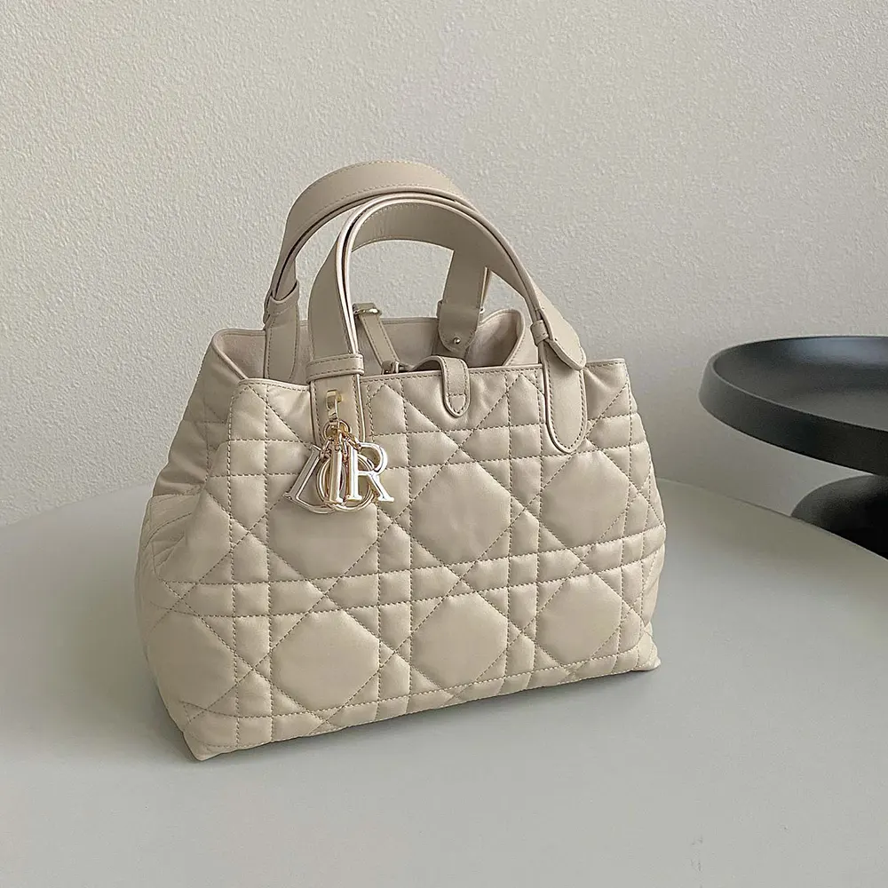 Side view showing polished hardware on Dior Women Medium Dior Toujours Bag