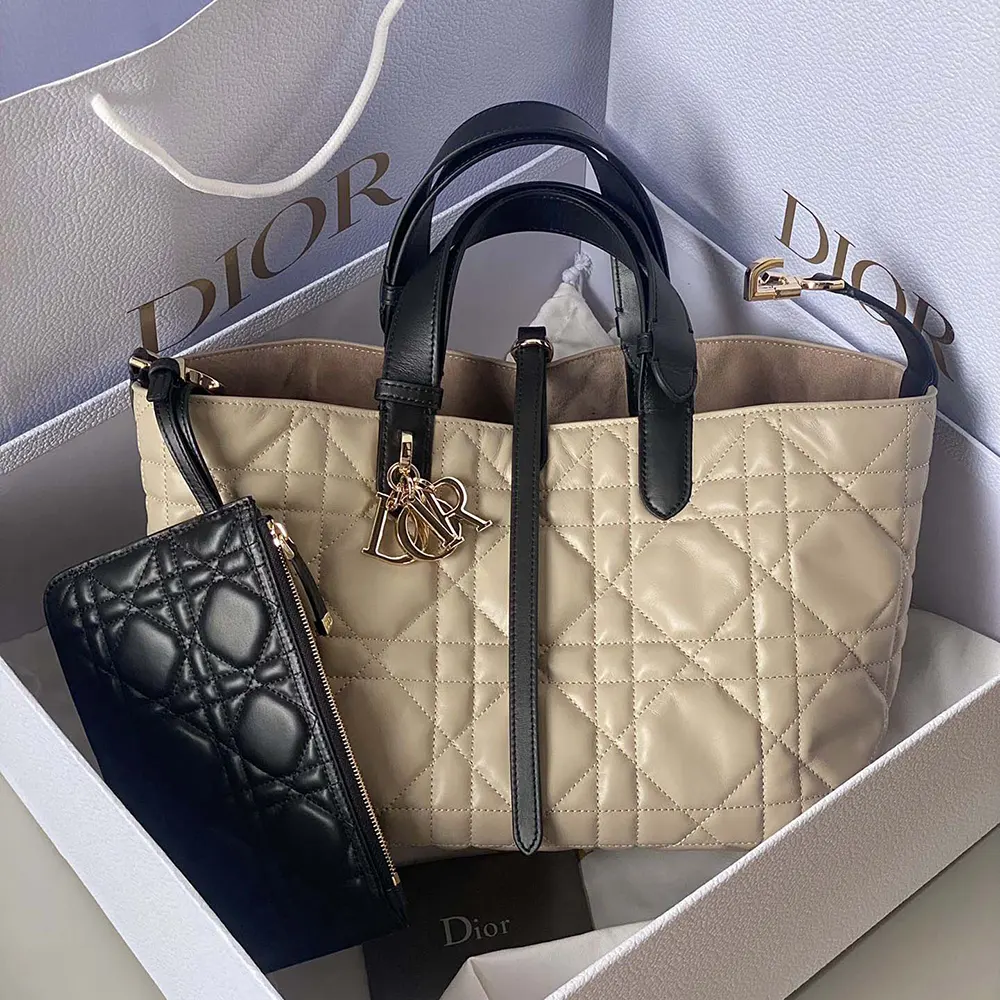 Close-up of black macrocannage pattern and silver hardware on Dior Toujours bag