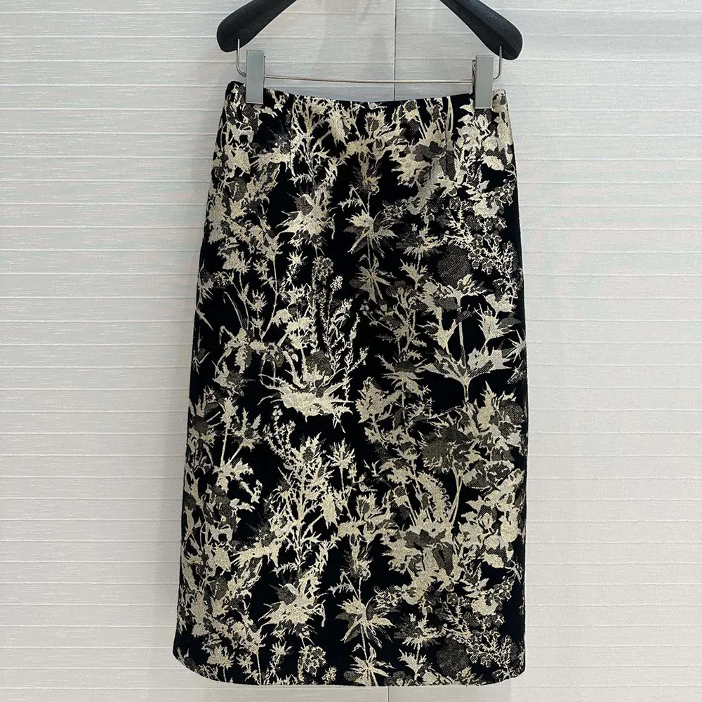 Side angle showing concealed zipper on Dior mid-length skirt