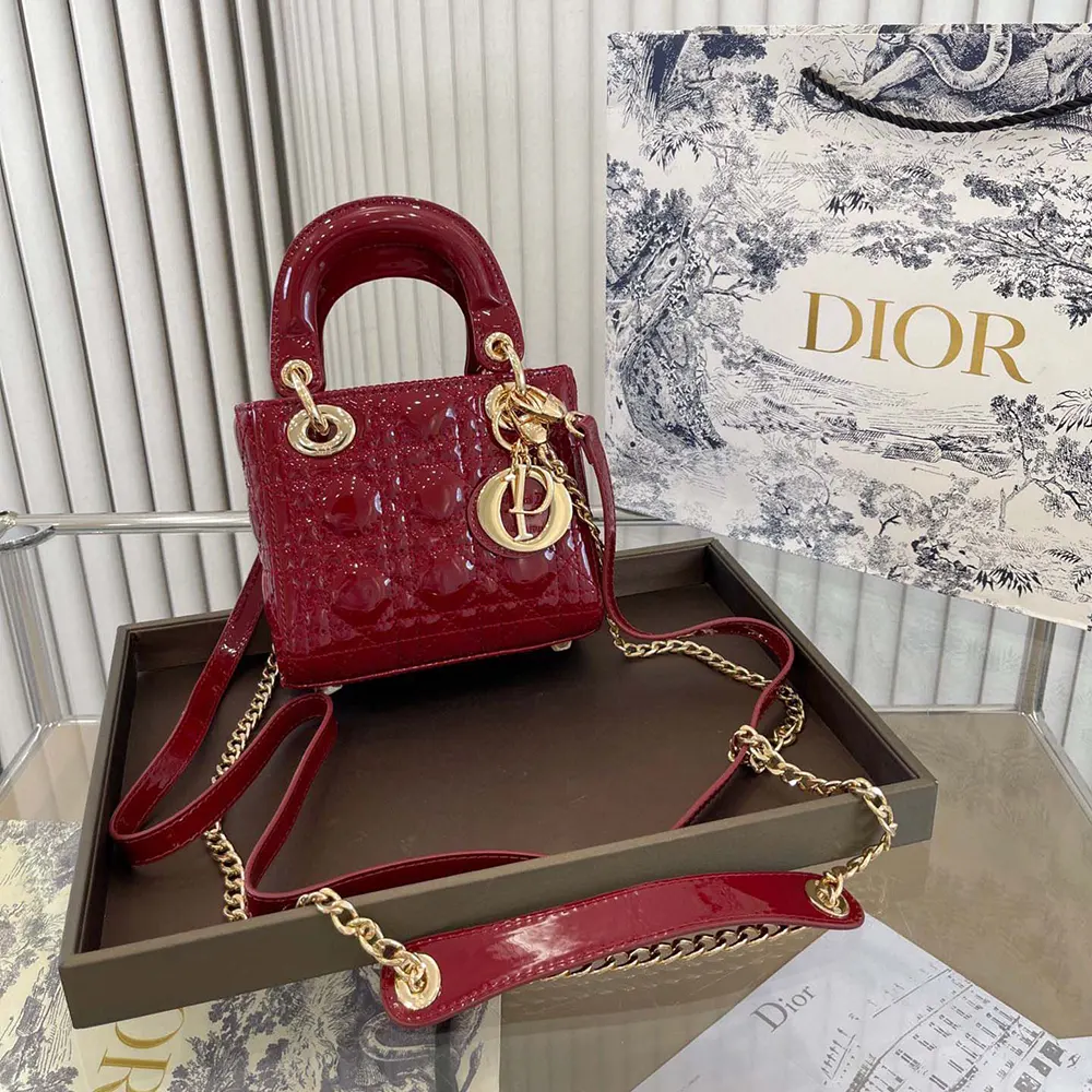 Side profile showing silver hardware on Mini Lady Dior Bag in cherry red