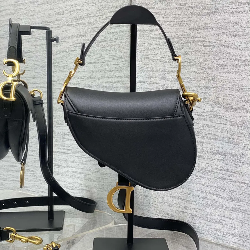Side angle showing adjustable strap on Dior Women Mini Saddle Bag