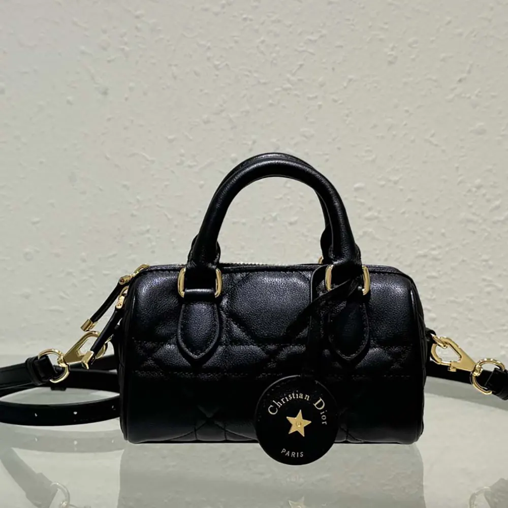 Close-up of black macrocannage calfskin texture on Dior Women Nano Dior Groove 17 Bag
