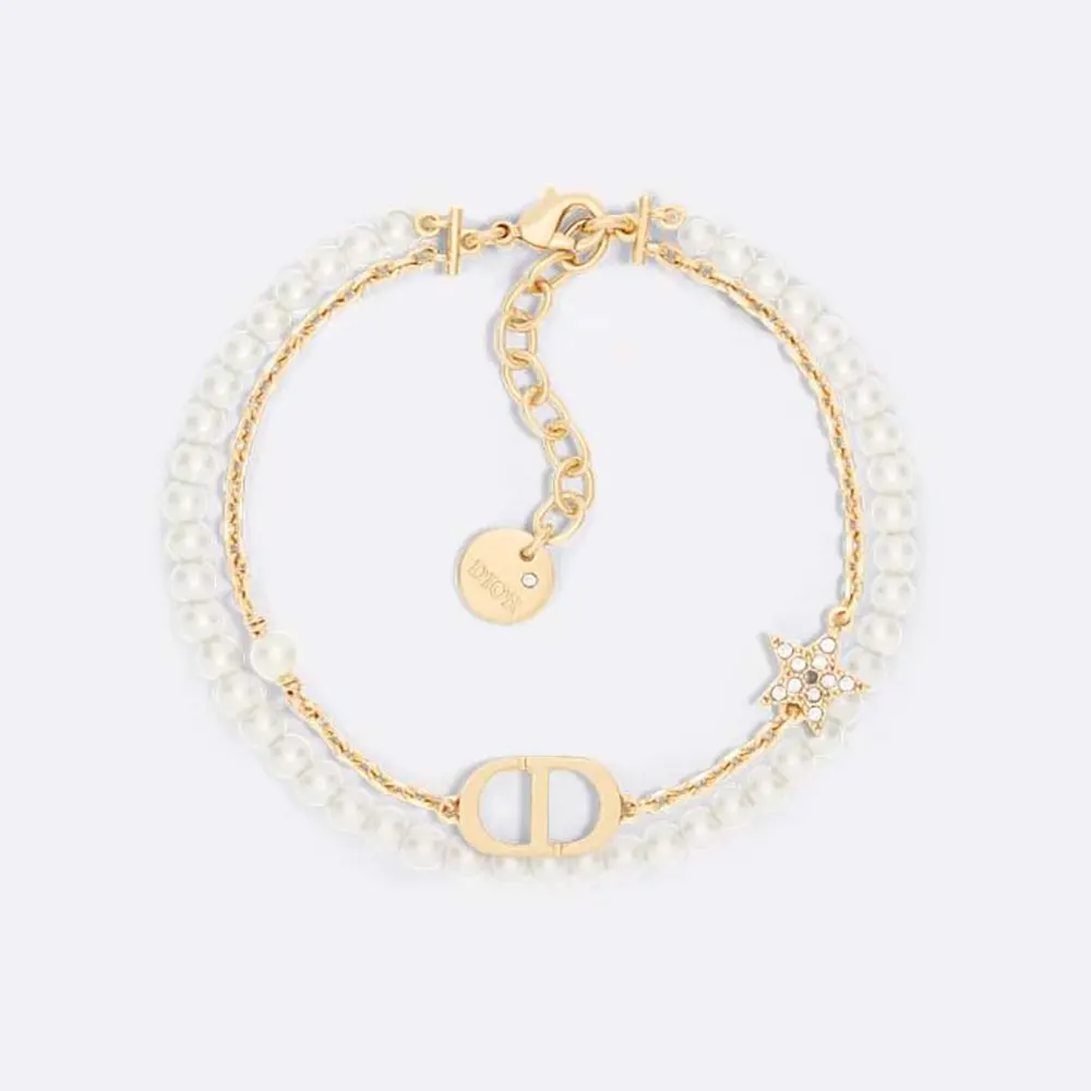 Close-up of Dior Women Petit CD Bracelet gold-finish metal and pearls