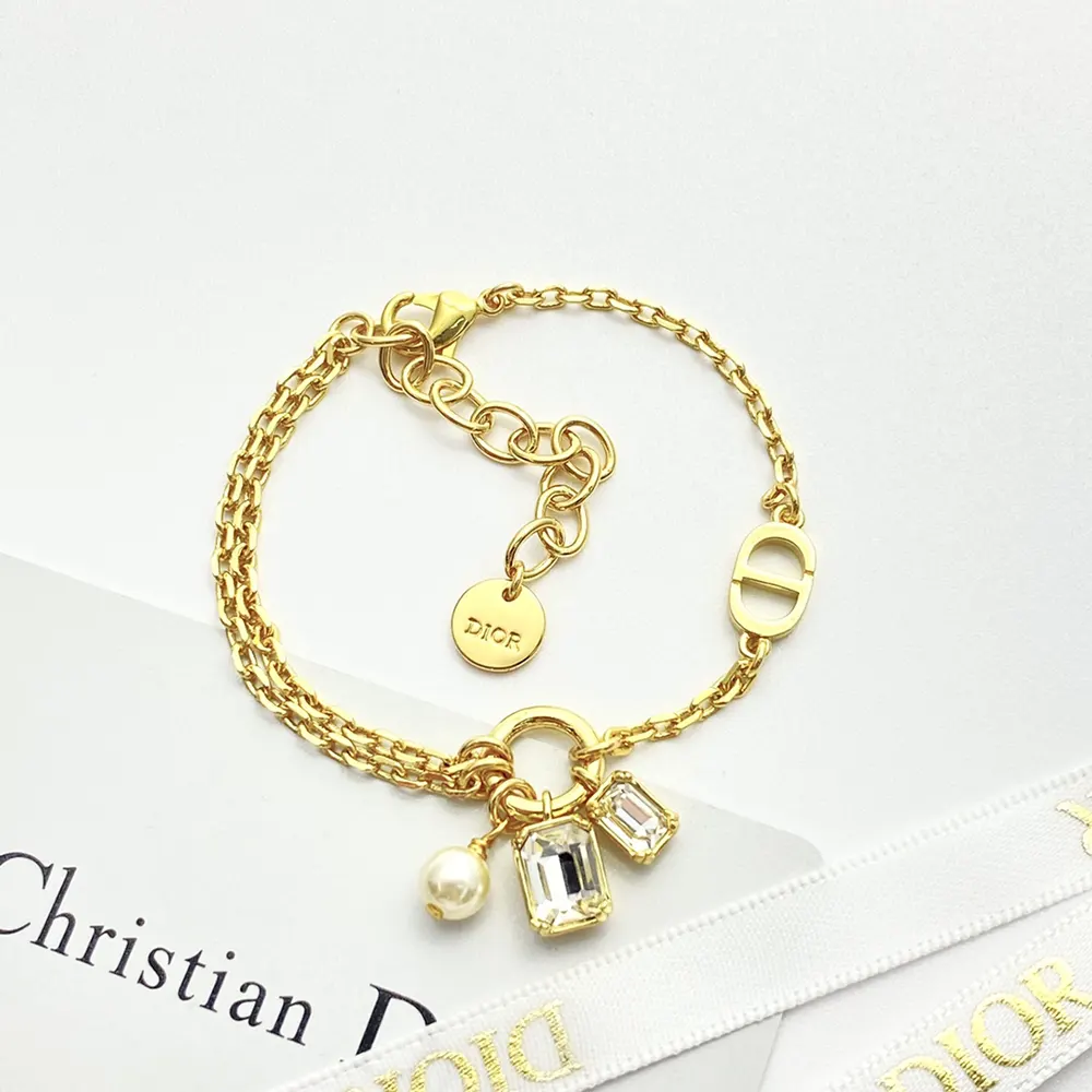 Side view of Dior Women Petit CD Bracelet highlighting gold finish