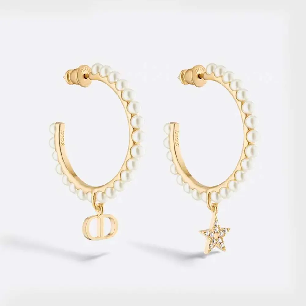 Close-up of Dior Women Petit CD Earrings gold-finish with white pearls
