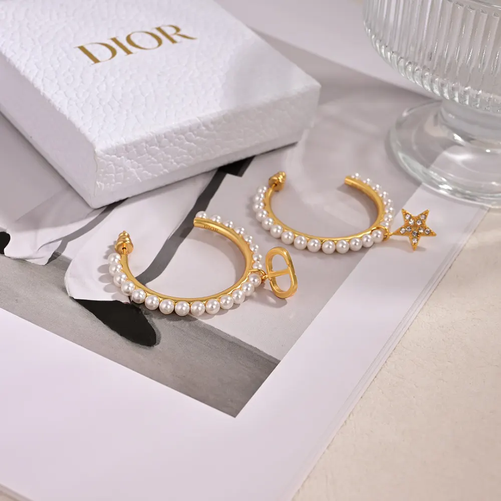 Side profile showing butterfly closure on Dior Women Petit CD Earrings