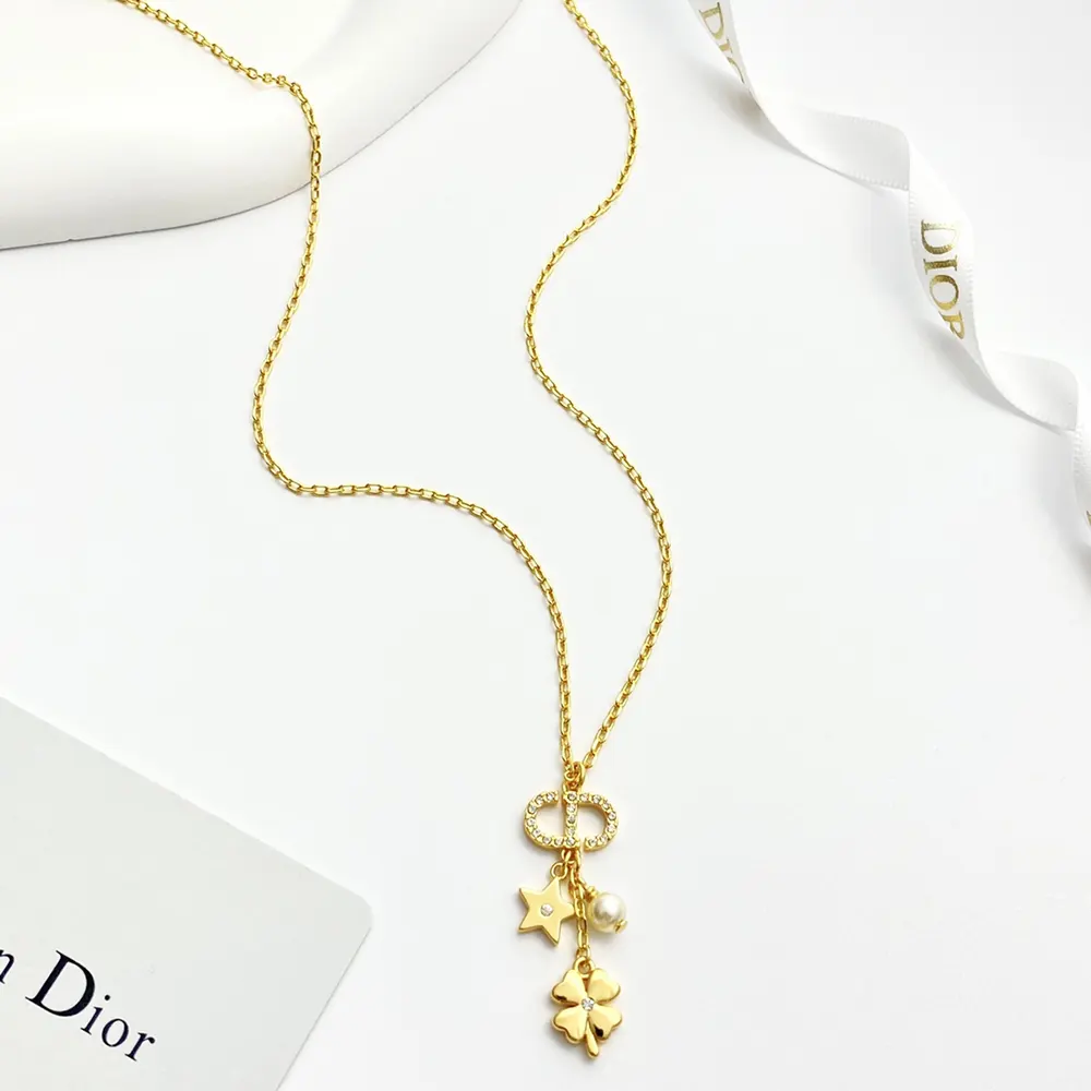 Side view showing white resin pearl on Dior Women Petit CD Lucky Charms Necklace
