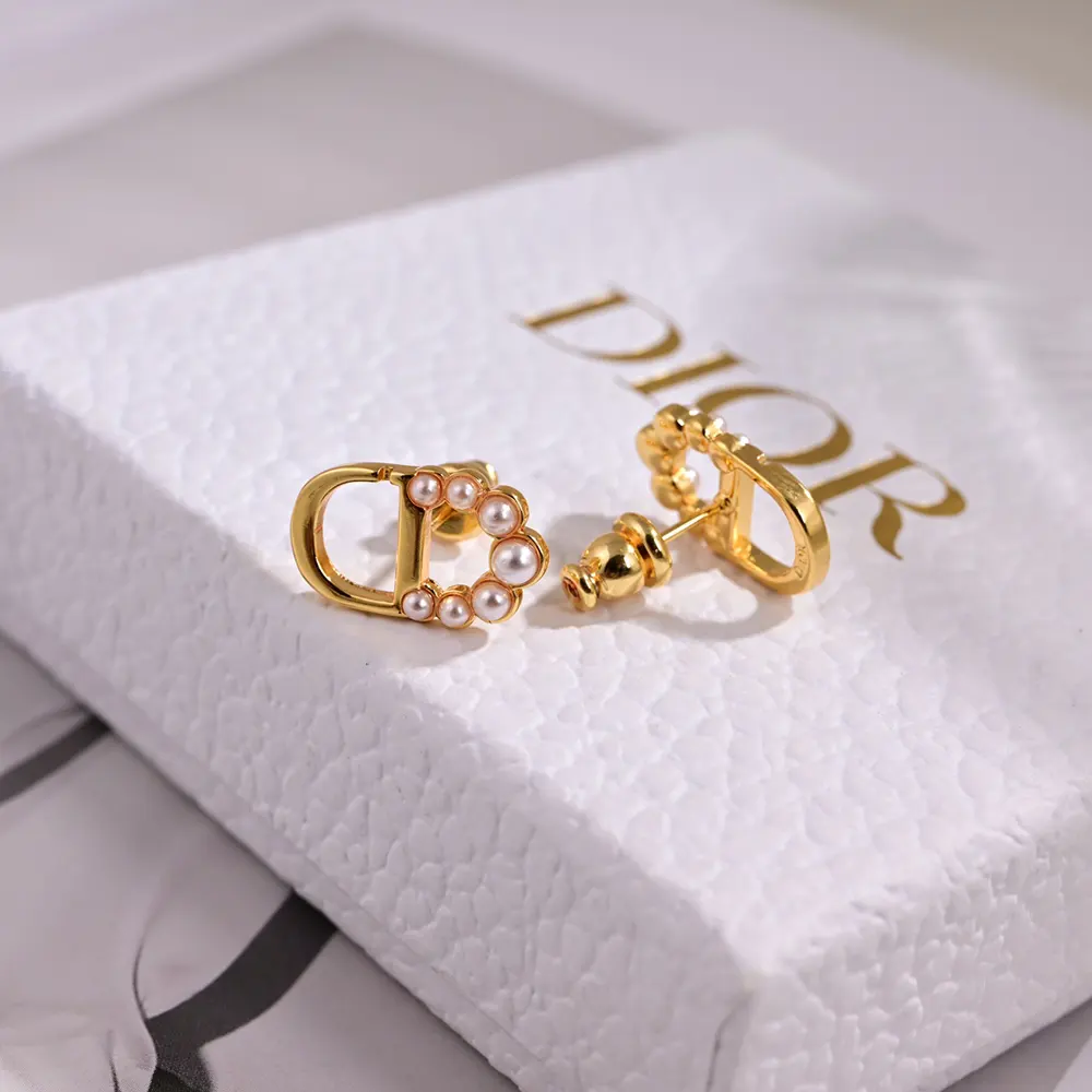 Pair of Dior Women Petit CD Mini Stud Earrings displayed on white background