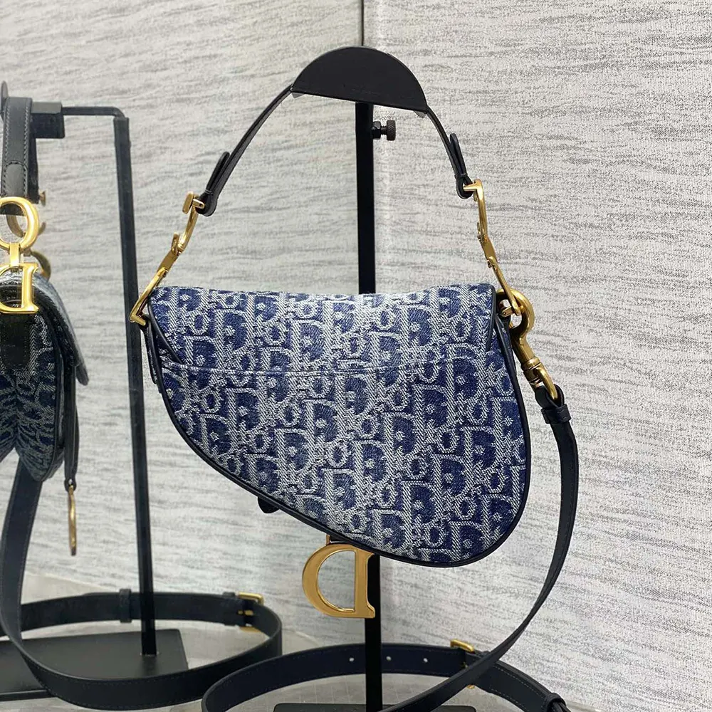 Side angle showing adjustable strap on Dior Women Saddle Bag with Strap Blue Denim Dior Oblique Jacquard