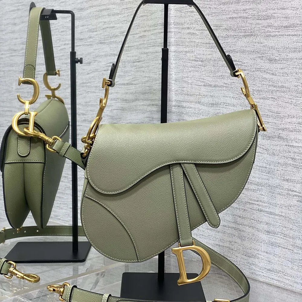 Close-up of gold-tone hardware on Dior Women Saddle Bag with Strap Cedar Green